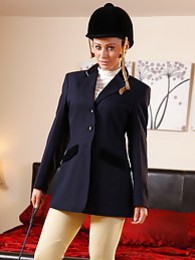 NuPornstars presents: Clare R seductifvely removes her riding gear leaving on only opaque hold ups and sheer underwear